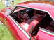 1971 Ford Ranchero - The interior of a red 1966 Buick Riviera shows off its plush seating and classic dashboard design.