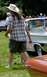 1971 Ford Ranchero - A white convertible with extensive chrome detailing is visible at an outdoor event.