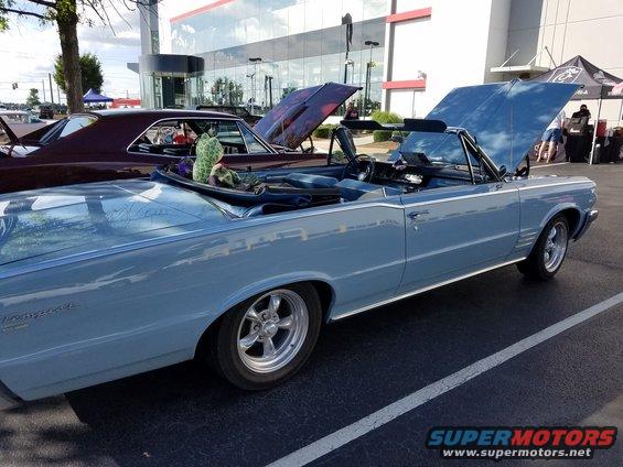 Light blue 1965 Pontiac Tempest convertible with hood open, side view