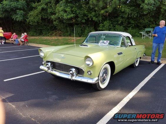 1955 Ford Thunderbird, light green with white hardtop, parked in a lot