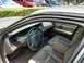 2003 Ford Crown Victoria - Interior view of a 2003 Ford Crown Victoria, highlighting the dashboard and seating.