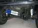 1989 Ford Bronco - Close-up view of rear axle and suspension components, including new shocks.