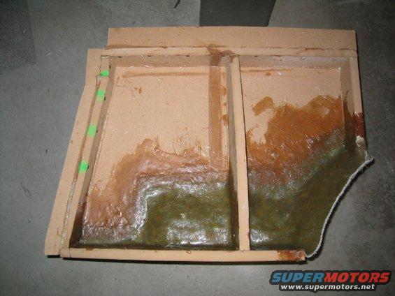 Fiberglass mold with wooden frame, appears to be for a car part like a subwoofer enclosure