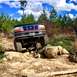1995 Ford Bronco - This 1995 Ford Bronco tackles a challenging off-road course with large rocks.