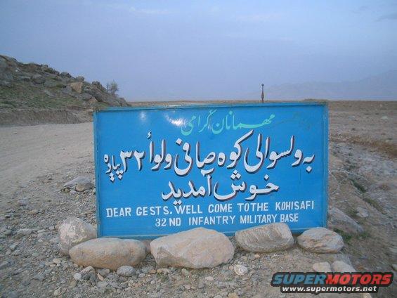 Blue sign for 32nd Infantry Military Base with English and Pashto text