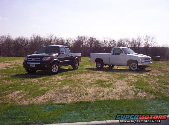 Black Toyota Tundra and white Chevrolet pickup trucks parked outdoors