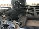 1970 Volkswagen Beetle - Close-up view of the undercarriage, showing suspension parts and a tire.