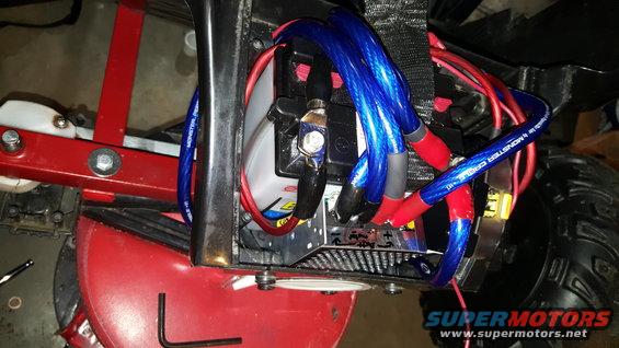 Close-up of battery and blue Monster Cable wiring