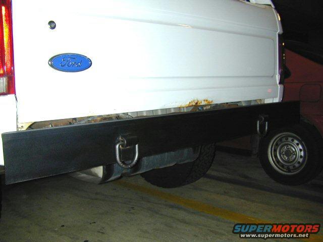 White 1995 Ford Bronco rear with flatbed and spare tire