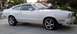 1978 Ford Mustang II - A white coupe with a distinctive body style and aftermarket wheels is parked on a paved surface.