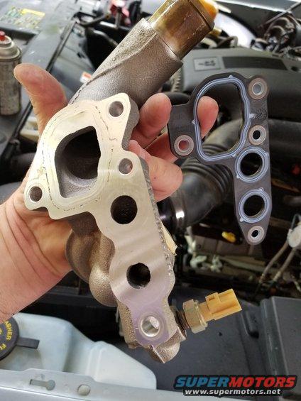 There was an oil leak near the front of the engine, which turned out to be the typical water outlet/filter base gasket.  I installed a new Ford F6AZ-6840-BA with some Indian Head shellac.