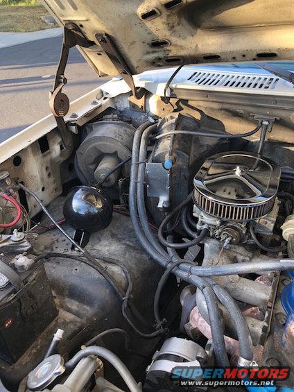 1981 Ford Bronco engine bay with carburetor and air cleaner visible