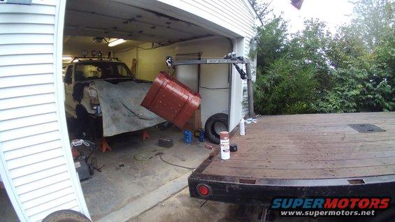 It started raining while I was painting it and every bay at my auto mechanic's shop was full so I couldn't hang it up in a bay to paint. So I had to get creative using my crane and covering my mechanic's Bronco so I wouldn't get over spray on it.