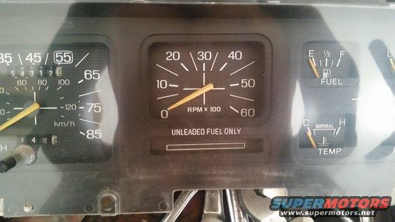 1985 Ford Bronco dashboard gauges with speedometer, tachometer, fuel, and temp