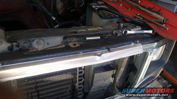 1985 Ford Bronco engine bay with tools on fender