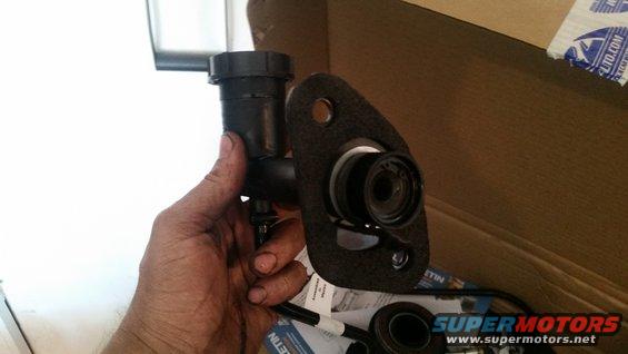 Clutch master cylinder assembly held in hand, part of a ZF swap