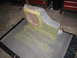 1994 Ford Bronco - A custom-made subwoofer enclosure is shown, covered in gray primer and yellow dust.