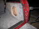 1994 Ford Bronco - A custom-built subwoofer enclosure is installed in the cargo area of a red SUV.