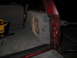 1994 Ford Bronco - Custom subwoofer box installed in the rear of a red SUV, with a power tool nearby.