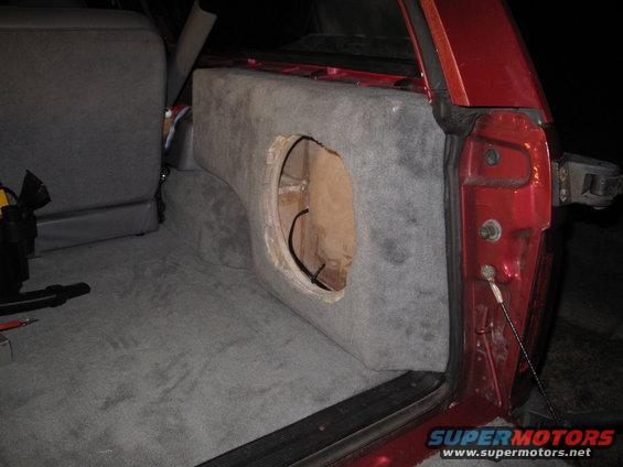1994 Ford Bronco interior with custom subwoofer box installed behind rear seat