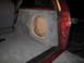 1994 Ford Bronco - A custom subwoofer enclosure is installed in the cargo area of a vehicle, ready for a speaker.