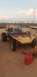 1970 Volkswagen Beetle - A custom dune buggy sits in a dusty outdoor area with a red gas can nearby.