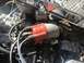 1970 Volkswagen Beetle - Close-up view of an engine bay, focusing on the distributor cap and associated wiring.