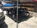 1970 Volkswagen Beetle - Rear view of a modified dune buggy with a visible engine and custom taillights.