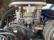 1970 Volkswagen Beetle - A detailed view of a vehicle's engine carburetor and associated wiring.
