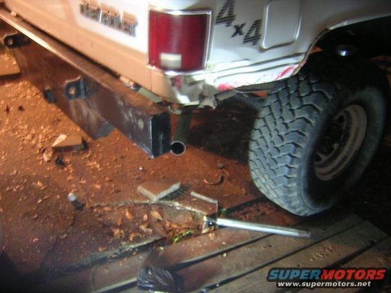 White Chevrolet K5 Blazer rear bumper and tire, with "4x4" decal visible
