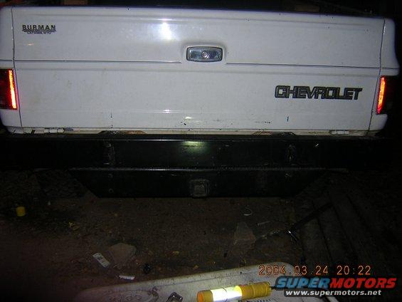 Rear of a white 1984 Chevrolet pickup truck with a black bumper and Chevrolet badging
