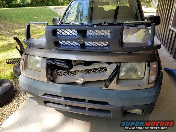 This grille was relatively inexpensive from eBay, and easy to install.  While it was out, I changed the headlights, too (also from eBay).