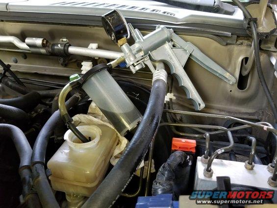Changing the reservoir's fluid doesn't change it all, but it's a start.  If this is done during each brake service, the old fluid will never be a problem.