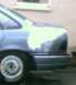 1986 Ford Taurus - You can see the white primer over most of the damaged area I kicked in. OOPS