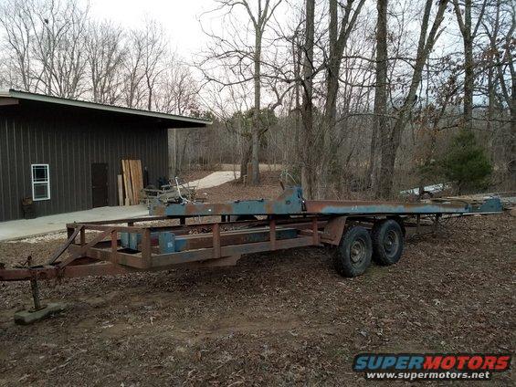 rotarytrailer13.jpg My original plan was to clean & paint it outdoors, and then figure a way to move it inside and install it.  But it rapidly became apparent that it needed more cleaning than I could do with it assembled, so I decided to take it apart, to do a thorough job.  The yokes (the cross pieces) are almost too heavy for me to carry, but not quite.  The runways are so heavy that I can barely shift one end, or roll them over one at a time, so they'll stay on the trailer.