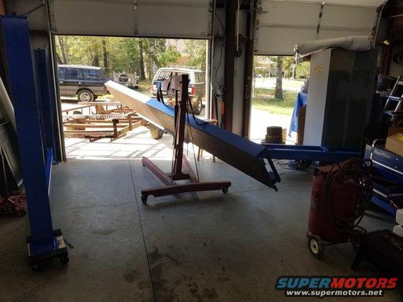20181005_133846.jpg Using the Bronco, the POS trailer, the engine hoist, some furniture dollies, some chain, and a few ratchet straps, I hauled the big HEAVY runways inside, and flipped them right-side-up onto the yokes.