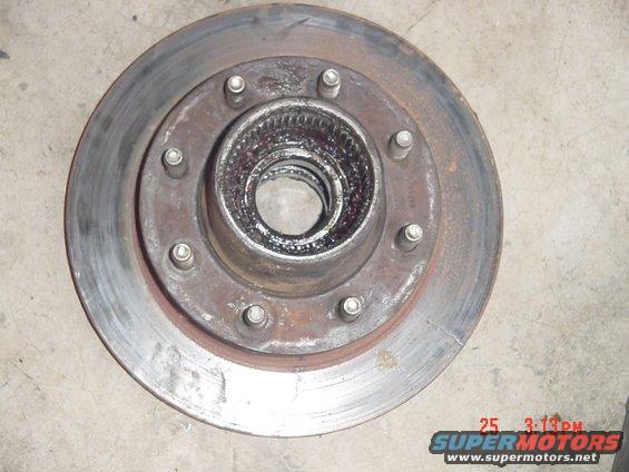 d60-003.jpg only thing that i know for shure that i haveto replace is this rotor, it has two splits in it. besides that everything down to the wheel bearings look very useible.