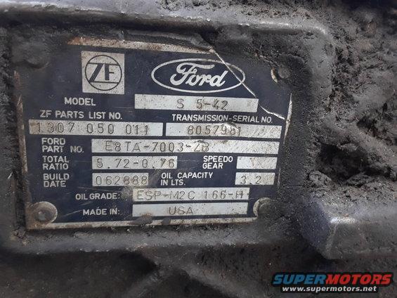 Close-up of a Ford ZF S5-42 transmission data plate with part numbers and build date