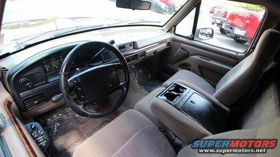 1992 Ford F-150 interior, tan upholstery, driver's side dashboard and steering wheel visible