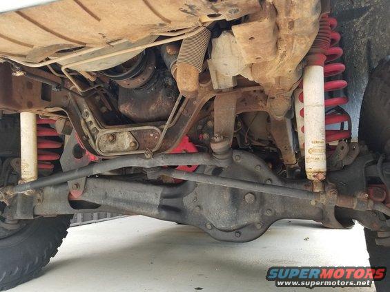 20181009_134109.jpg The gaudy red lift seems to have been installed almost well-enough, but there's a lot of slop in the suspension, and some significant engine leaks.  The front sway bar is gone, but the rear is still there.