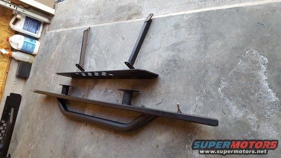 Here's a shot of the assembly that will bolt up underneath the truck.  From the outside in, there is the slider with step, the truss, and the bracing that will mount to the truck body.  The truss is held to the truck body at the top with 4 bolts.  These 4 bolts are in shear and will bear the weight of the step (and the person stepping on it).  Additionally, the braces (in compression) will bear the axial load that will be placed on the truss and transfer that load to the inside body mount locations.  All mounting locations on the truck are stock, and no holes need to be drilled.