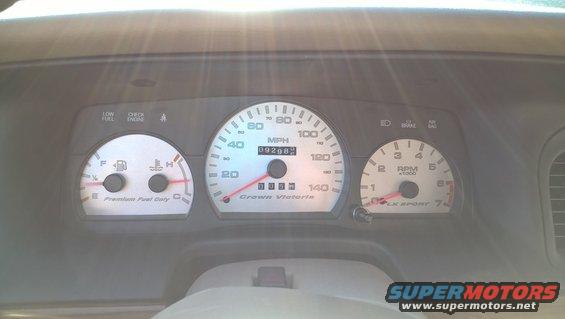 2004 Ford Crown Victoria dashboard with speedometer, tachometer, fuel, and temperature gauges. Odometer reads 09268