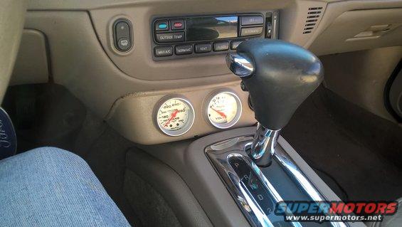 Interior dashboard with two gauges and automatic gear shifter