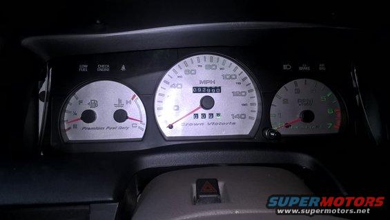Dashboard gauges for a 2004 Ford Crown Victoria showing 92,990 miles and RPMs