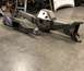 1979 Ford Bronco - Custom suspension parts are shown on a concrete floor in a workshop setting.