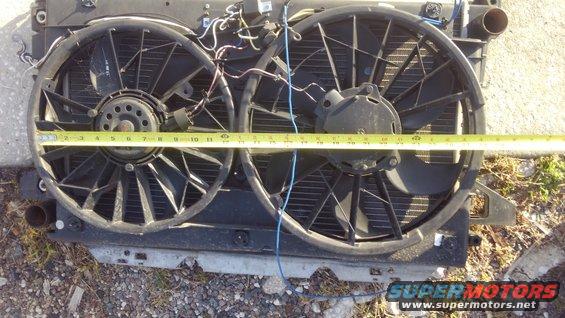 kimg0315.jpg the small fan is about 12&quot;. the large fan is about 15&quot;. it pushes plenty of air

i used 2 separate single fan wiring kits. each fan is stand alone jsut incase the other fails it will not affect the other. each one has its own temp probe and adjustable dial. everything is contained onto the shroud itself for easier radiator replacement 