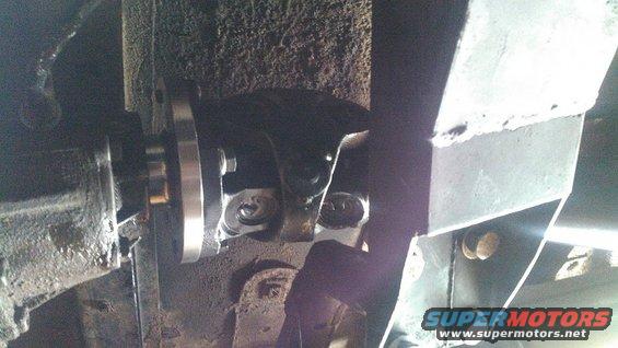 Close-up of a drive shaft flange bolted to a differential or transmission output shaft