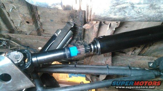 close-up of vehicle driveshaft connection with blue markings