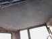 1909 Ford Model T - The interior ceiling of a vintage vehicle, showing the fabric headliner and window frames.