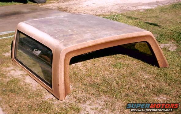 1980 Ford Bronco hardtop removed from vehicle, sitting on grass